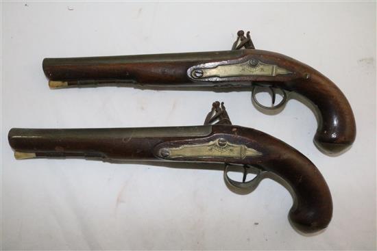 A pair of early 19th century flintlock holster pistols, signed Weston, Lewes, 15in.